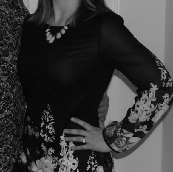 Chic Black Dress with Floral Accents - Picture 7 of 7